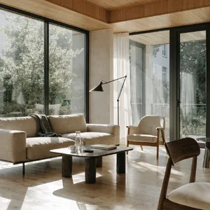 A photorealistic interior of a modern Scandinavian-style living room with natural light streaming through floor-to-ceiling windows. Show detailed wood textures, fabric materials, and proper light reflections. - Recraft Recraft V4.1