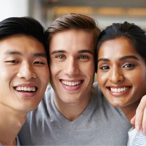 A group selfie of three friends of different ethnic backgrounds smiling at the camera. - Reve Reve Image (Halfmoon)
