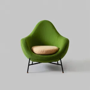 An armchair designed in the shape of an avocado, presented in a contemporary product photography style with professional studio lighting against a minimalist background. - Reve Reve Image (Halfmoon)