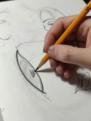 A hand drawing a sketch on paper with a pencil, the hand and pencil tip in clear focus. - XAI Grok Imagine (Quality)