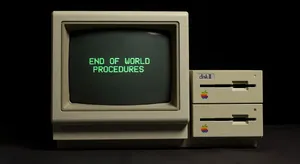 Vintage Apple II computer with green monochrome CRT screen, displaying 'END OF WORLD PROCEDURES' in green text. Two external floppy drives stacked on the right, labeled disk II with rainbow Apple logos. Beige casing, black background, retro aesthetic. - XAI Grok Imagine