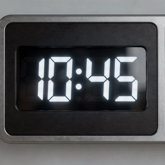 A digital clock display showing the time "10:45" in LED-style numerals, photorealistic… - Black Forest Labs FLUX.2 Max