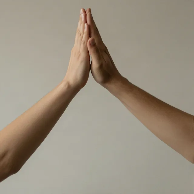 Two people high-fiving, with focus on their hands meeting mid-air. - Z-Image Turbo
