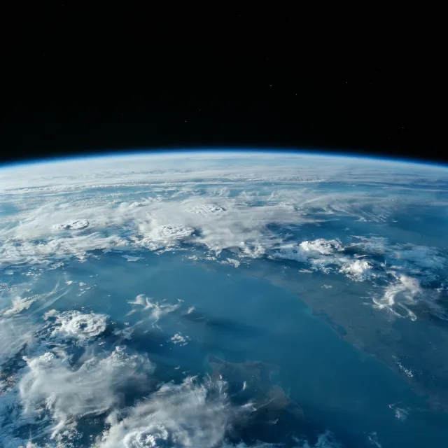 Photorealistic aerial photograph clearly showing the edge of the Earth from space… - Ideogram 4.0 (Quality)