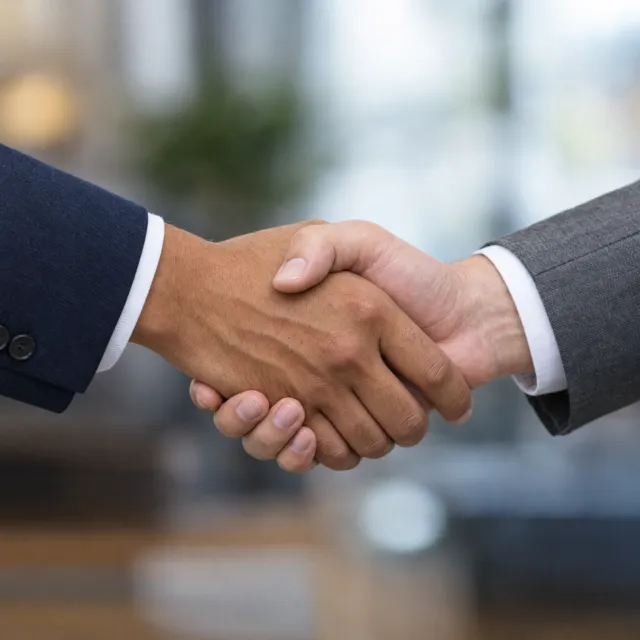 A close-up of two people shaking hands, both hands fully visible with five fingers each… - OpenAI GPT Image 2.5 Flare