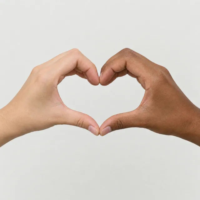 Two hands forming a heart shape together against a plain background - OpenAI GPT Image 2.5 Flare