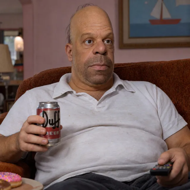 A famous cartoon character (e.g. Homer Simpson) rendered fully photorealistically as if a real human being, accurately preserving recognizable facial features and proportions - GPT Image 2.5 Sunburst