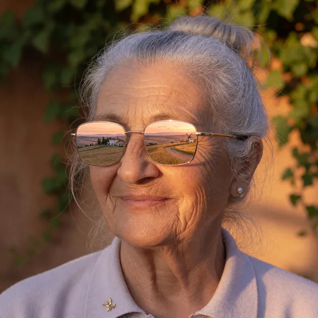 A ultra high-resolution portrait of an elderly woman with silver hair and bifocal… - XAI Grok Imagine (Quality)