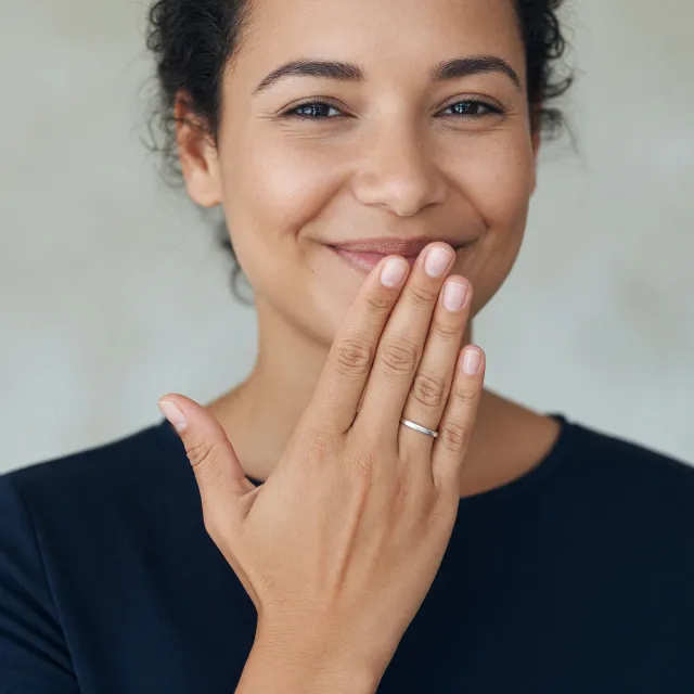 Photorealistic close-up portrait of a person clearly performing the American Sign… - XAI Grok Imagine (Quality)