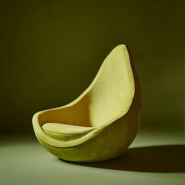 An armchair designed in the shape of an avocado, presented in a contemporary product… - Midjourney V6.1