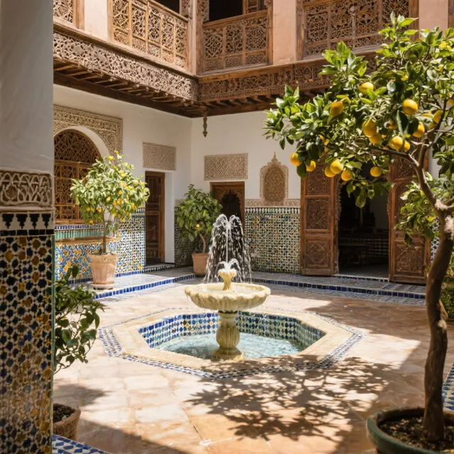A traditional Moroccan riad courtyard with detailed zellige tilework, flowing fountain… - Bytedance Seedream 3.0
