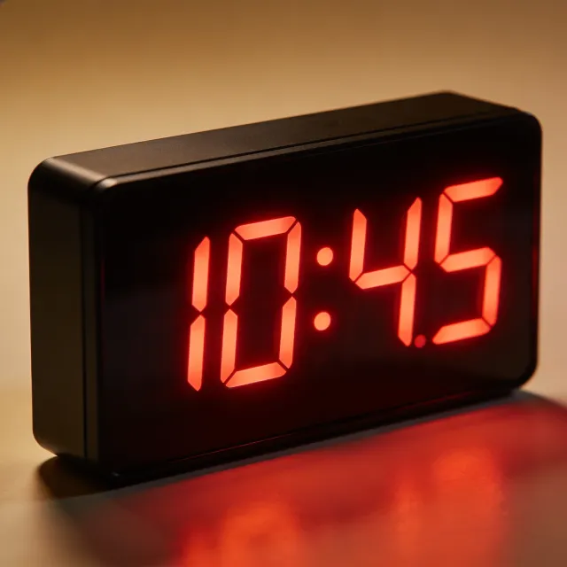 A digital clock display showing the time "10:45" in LED-style numerals, photorealistic… - Bytedance Seedream 4.5