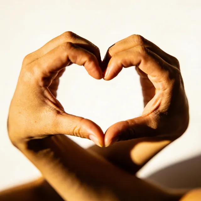 Two hands forming a heart shape together against a plain background - Bytedance Seedream 4.5