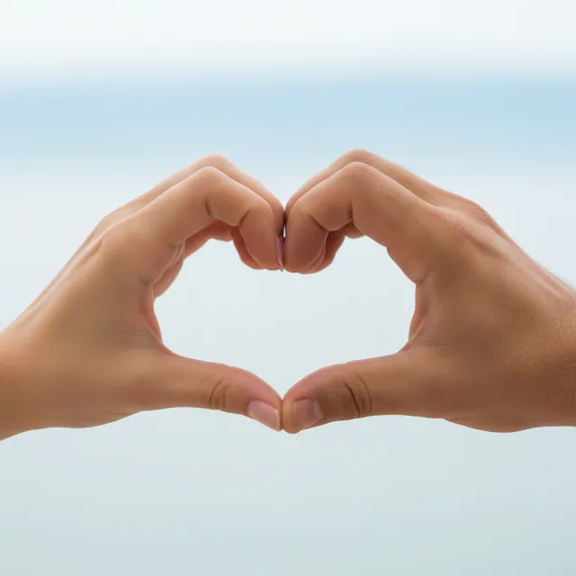Two hands forming a heart shape together against a plain background - Google Nano Banana (2.5 Flash)