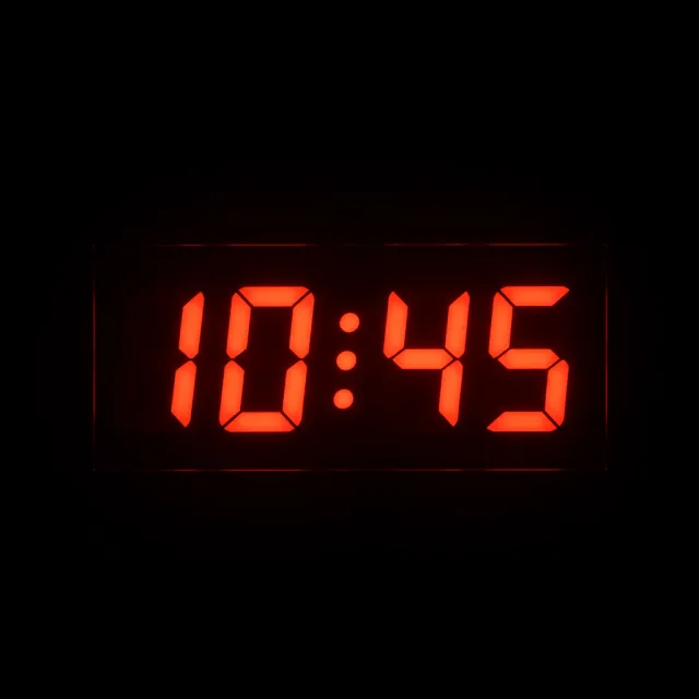 A digital clock display showing the time "10:45" in LED-style numerals, photorealistic… - Google Imagen 3.0
