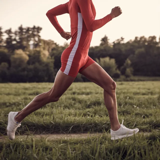 A runner mid-stride in a full-body action shot, limbs in motion and well-defined - Ideogram V2