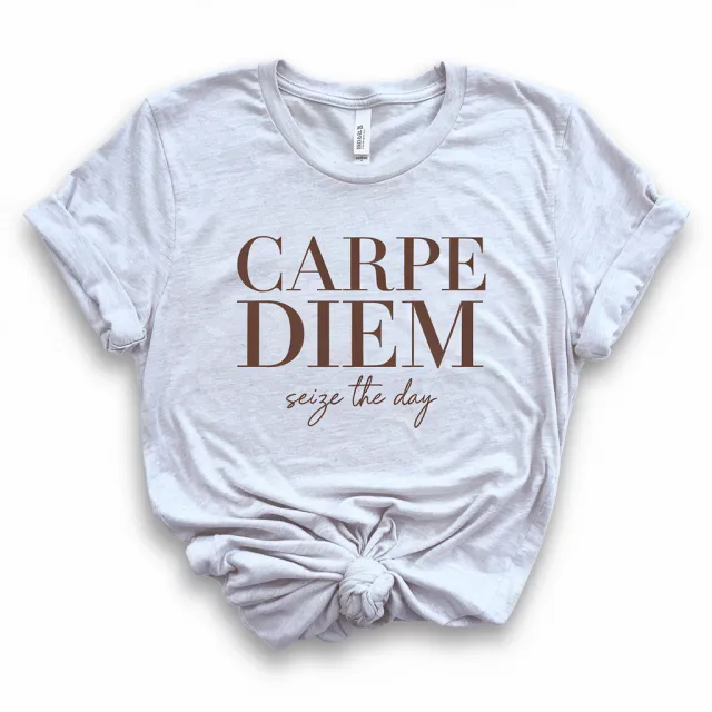 A wrinkled white T-shirt with "Carpe Diem" in bold serif font and "Seize The Day" in… - Ideogram V2