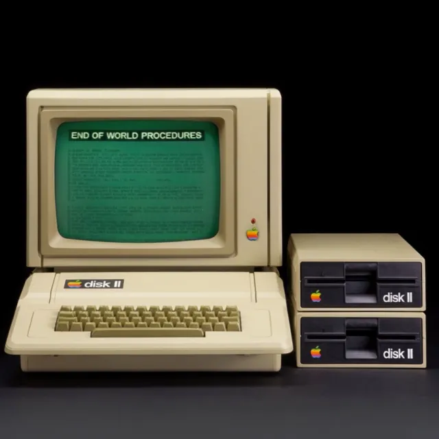 Vintage Apple II computer with green monochrome CRT screen, displaying 'END OF WORLD… - Krea 2 Large
