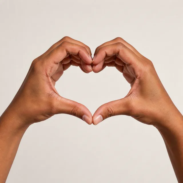Two hands forming a heart shape together against a plain background - Black Forest Labs FLUX 3 Image